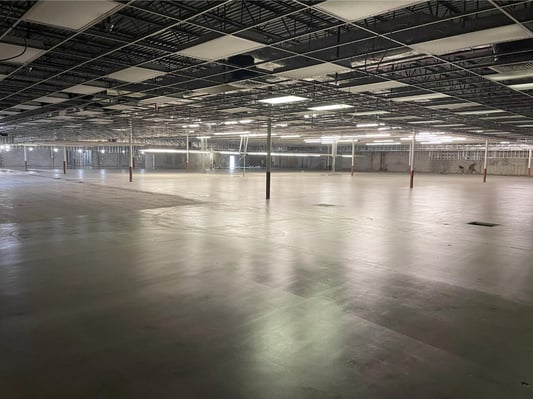 An expansive warehouse in Somerset with a grind &amp; seal coating installed on the concrete floor.