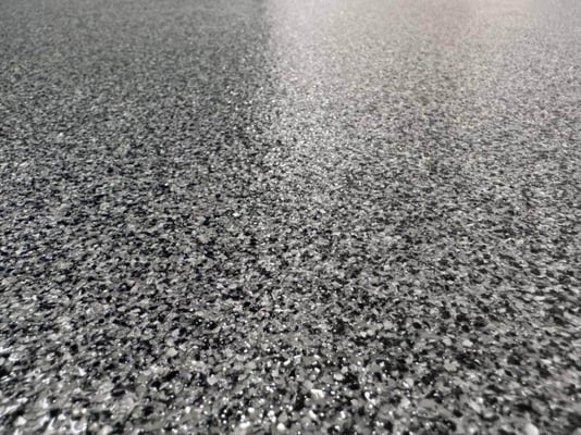 A close-up look at paint chip epoxy flooring.