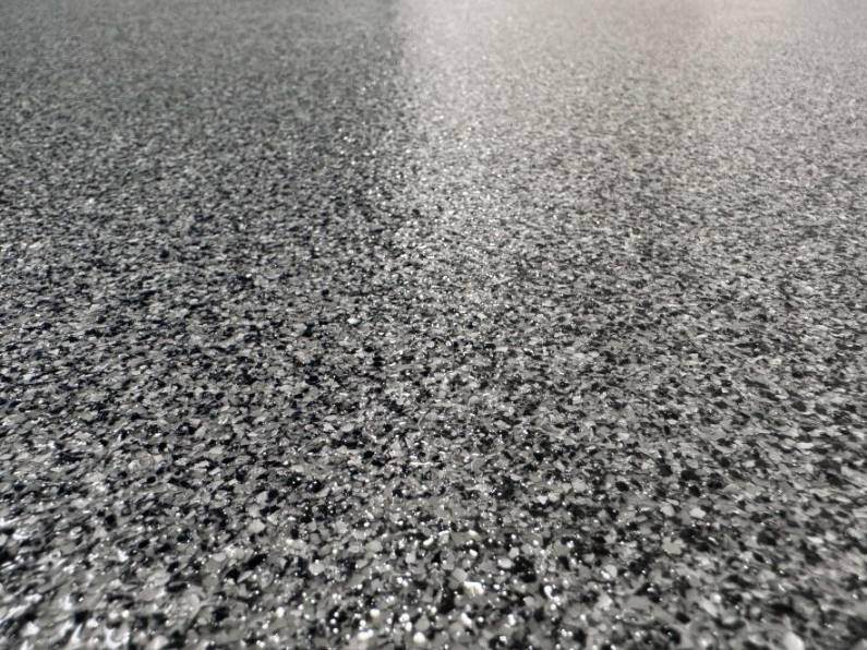 A close-up look at paint chip epoxy flooring.
