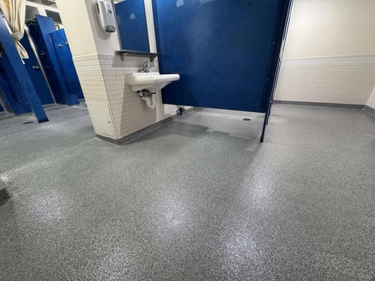 Paint chip epoxy floor installed by Elite Floor Coatings in a Mercersburg bathroom.
