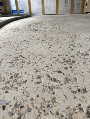 Concrete before being repaired from pitting.