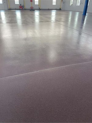 A red quartz epoxy floor installed in an expansive room in Emmitsburg, MD.