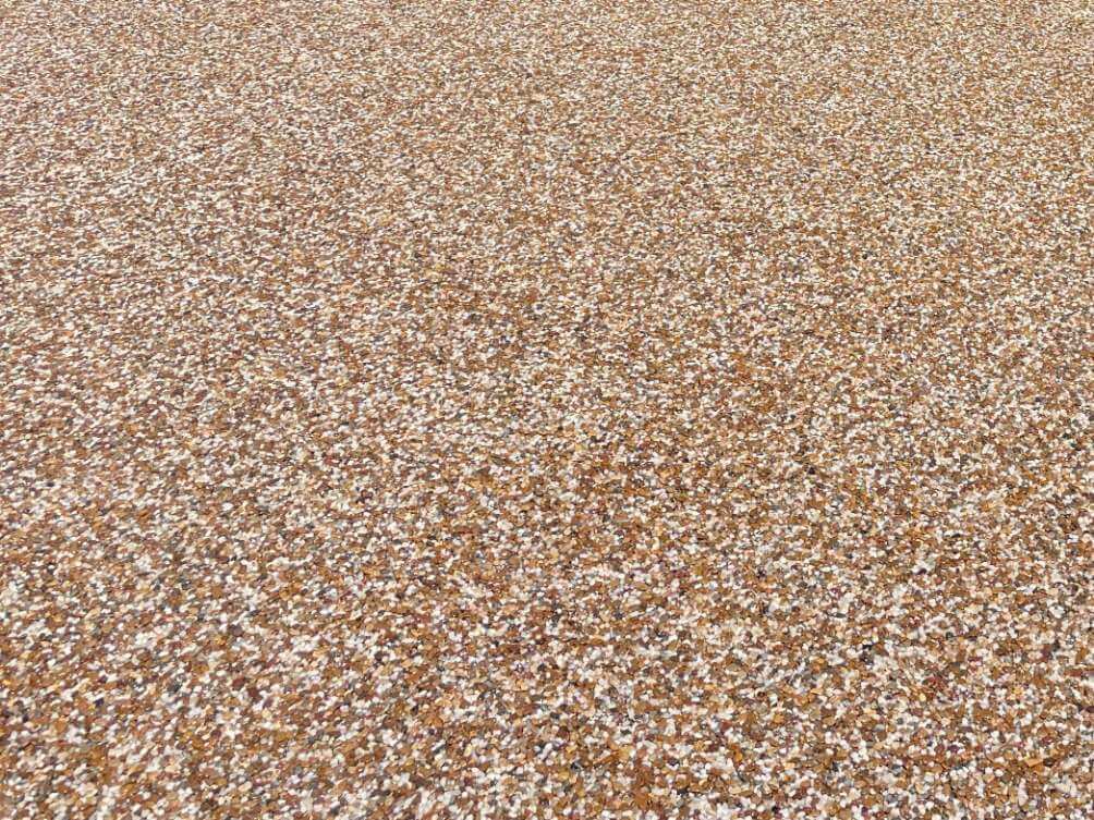 A closer look at river rock epoxy coating on outdoor concrete.