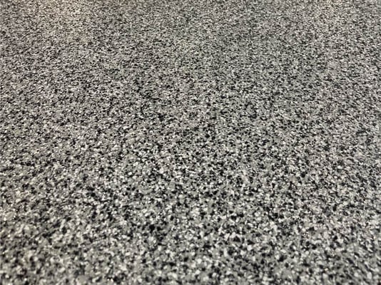 A close-up view of paint chip epoxy floors.