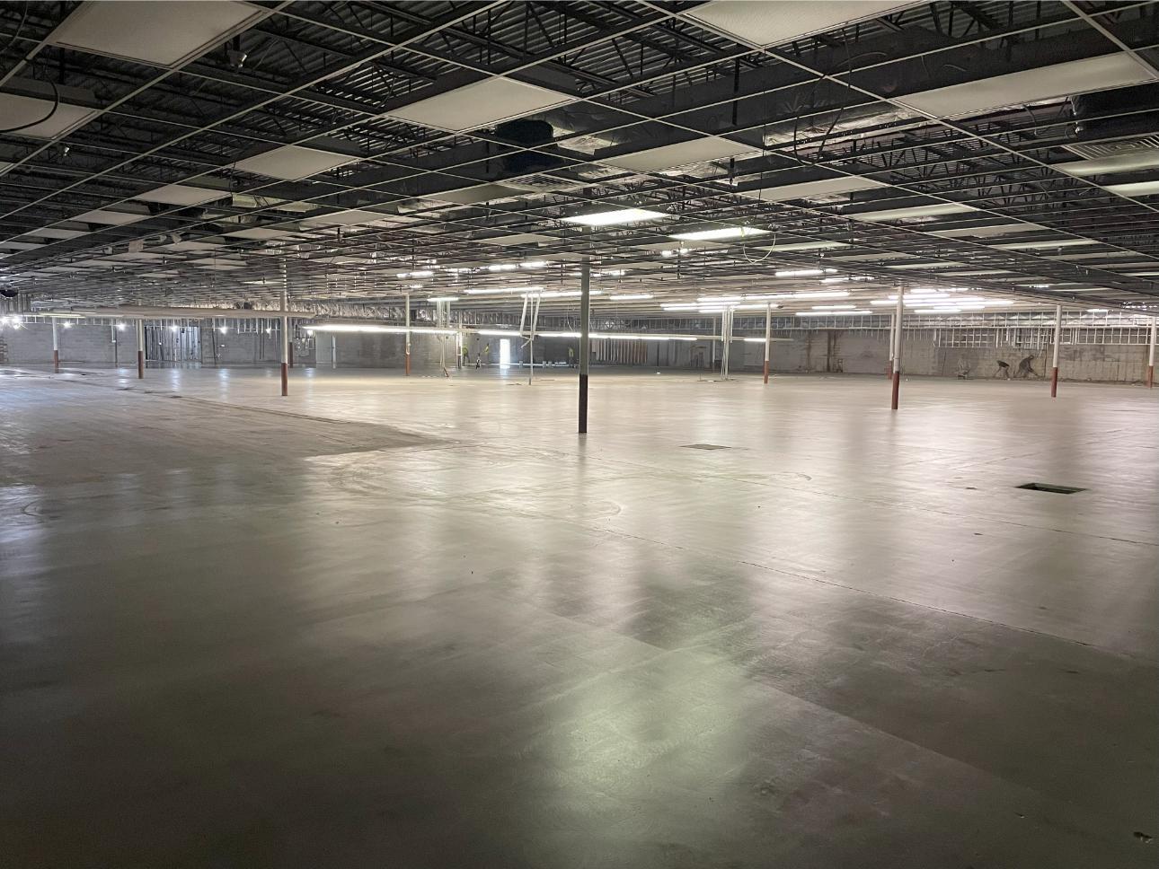 An expansive warehouse in Somerset with a grind & seal coating installed on the concrete floor.