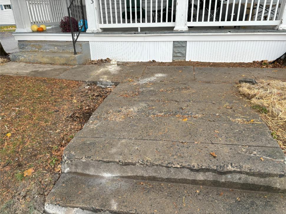 A concrete sidewalk repaired with polyjacking.