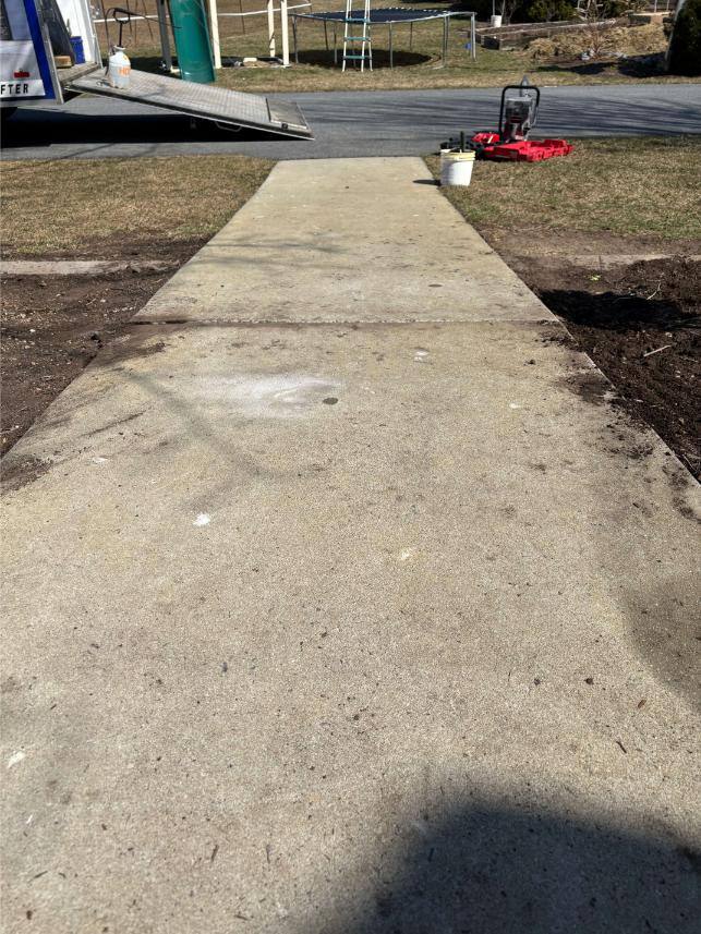 Concrete sidewalk in Orrstown, PA, repaired with concrete polyjacking.