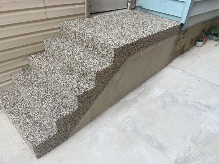 A set of stairs at a home in Waynesboro, PA, coated with river rock epoxy coating.