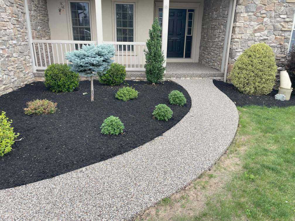 The sidewalk of a home in Chambersburg, Pennsylvania, after coating with river rock epoxy.