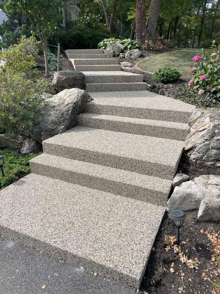 Concrete steps in New Franklin, PA, coated with river rock epoxy.