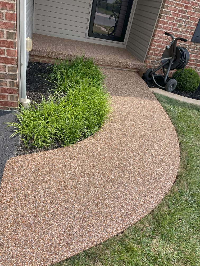 A front porch and sidewalk in Waynesboro, PA, coated with a river rock epoxy coating.
