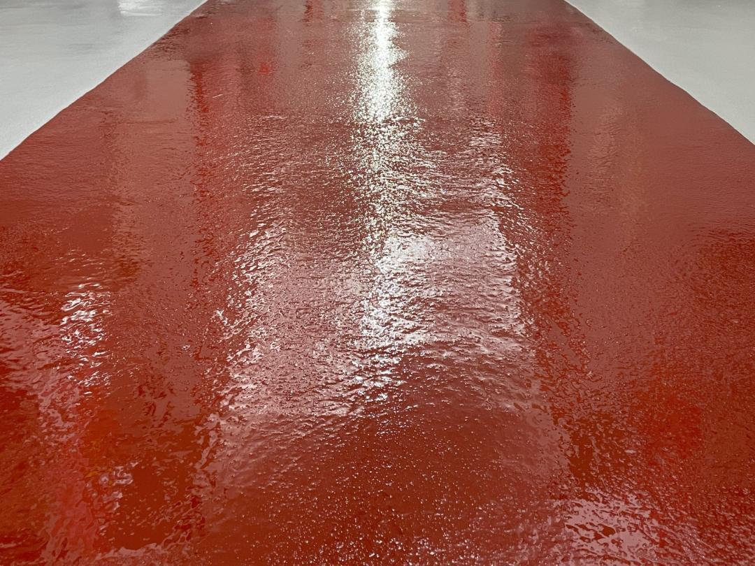 A close-up look at an acid-resistant coating installed on the floor of a robot farm in Rockville, Maryland.