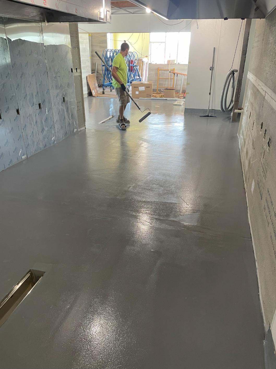 Installing urethane slurry coating to concrete in a fast food restaurant in Frederick, Maryland.
